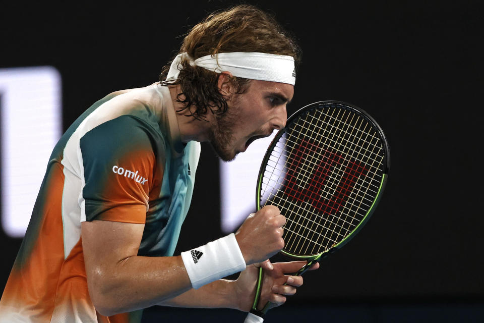 Stefanos Tsitsipas of Greece reacts after winning a point against Taylor Fritz of the U.S. during their fourth round match at the Australian Open tennis championships in Melbourne, Australia, Monday, Jan. 24, 2022. (AP Photo/Tertius Pickard)