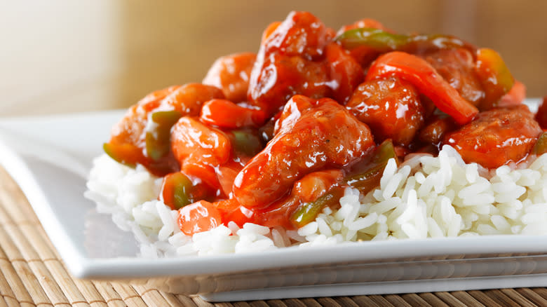 sweet and sour chicken on rice up close