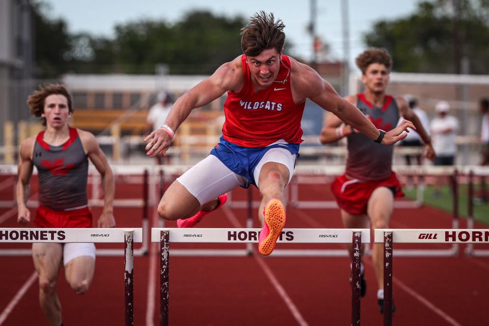 Gregory-Portland's Colton Harrison finishes first in the 300 meter hurdles event at Hornet Stadium on Thursday, April 13, 2023, in Corpus Christi, Texas.