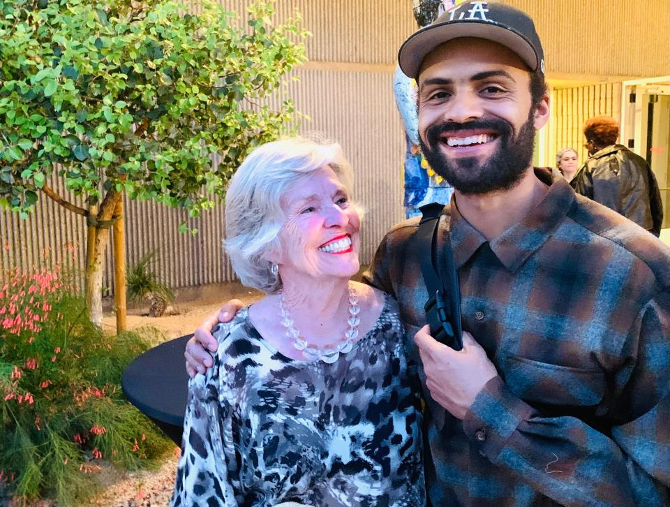 Proud grandma Rayma Wells attends the Palm Springs Art Museum's Exhibitions Opening Party on April 21, 2022, with artist and grandson Devin Reynolds.