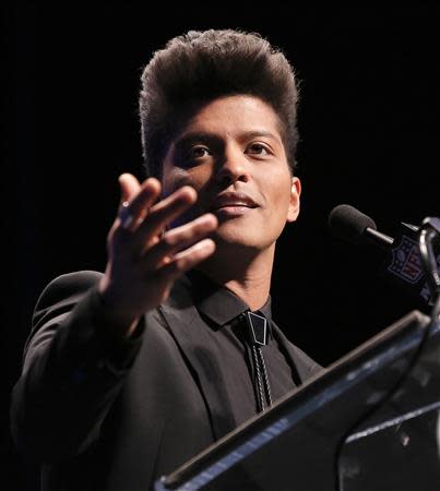 Singer Bruno Mars speaks at the Super Bowl half time press conference in New York, January 30, 2014. REUTERS/Andrew Kelly