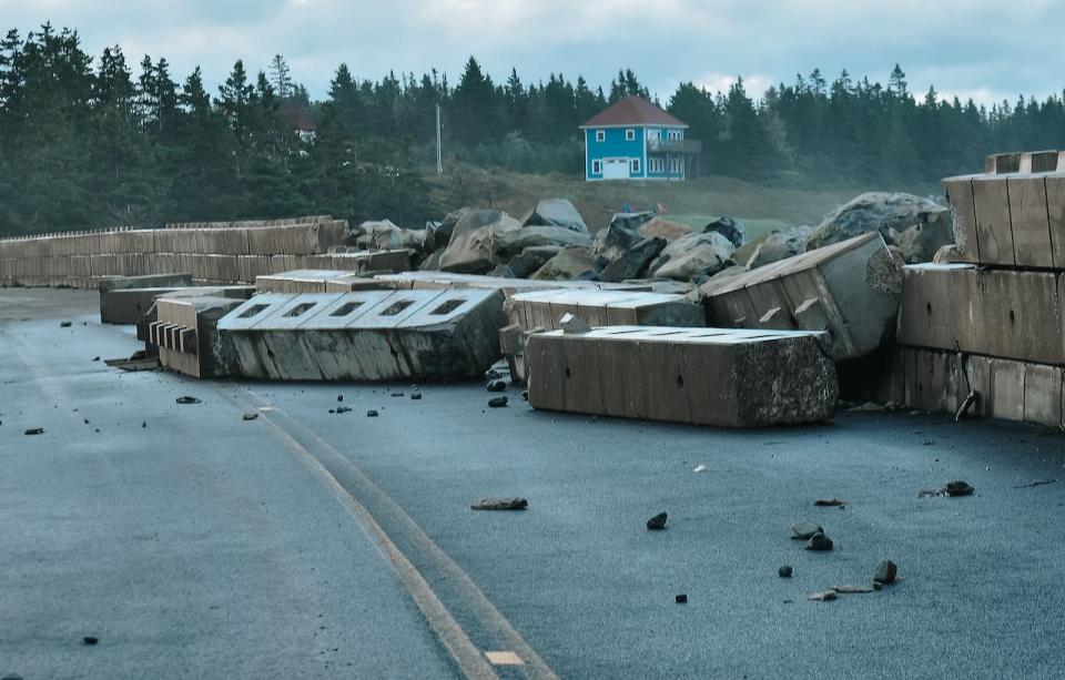 A seawall knocked down during Hurricane Lee on Shore Road in Liverpool, N.S. is shown in a handout photo.