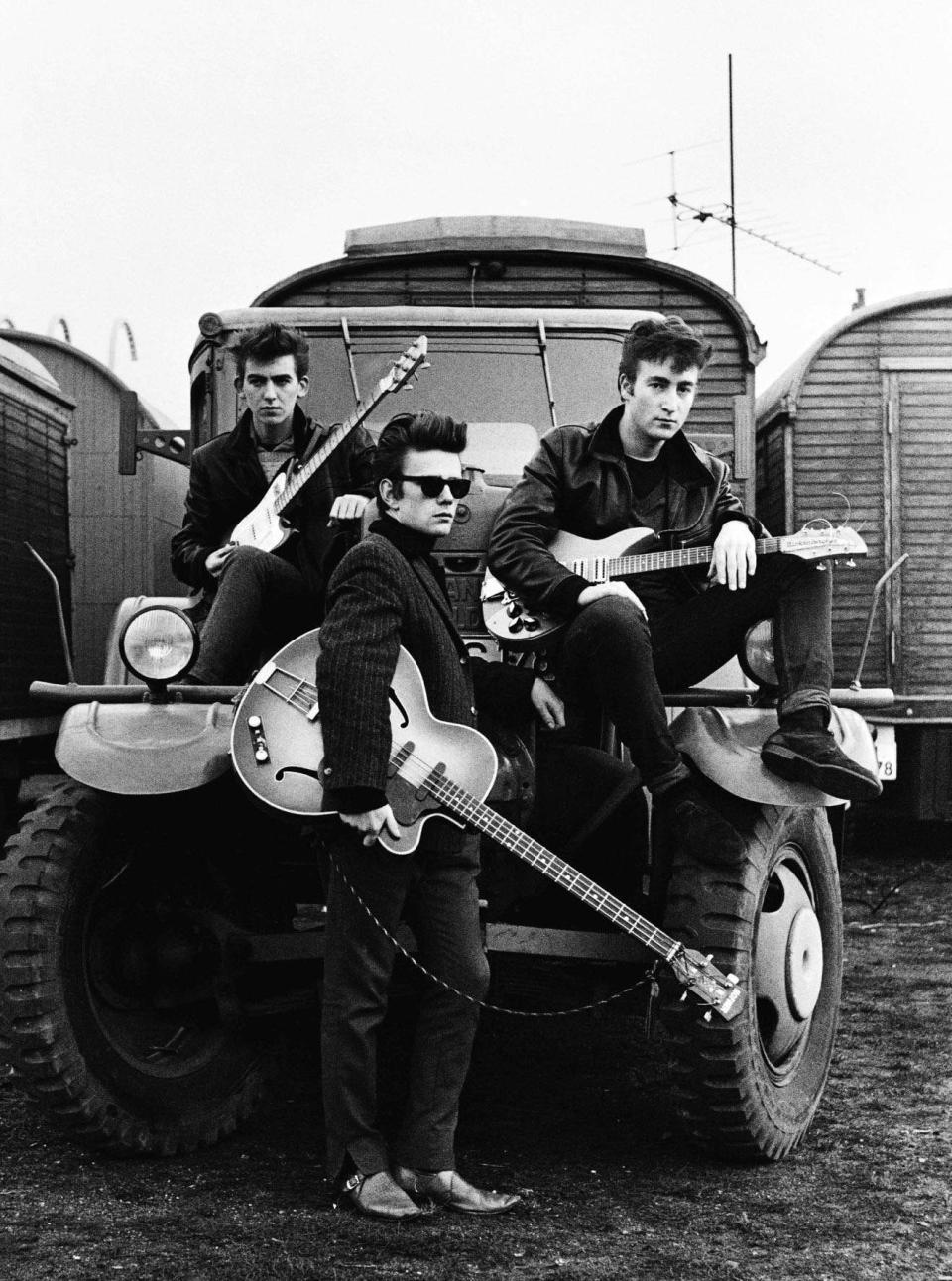 George Harrison, Stuart Sutcliffe and John Lennon in a Hamburg fairground, 1960 - Astrid Kirchherr/GENESIS PUBLICATIONS/PA