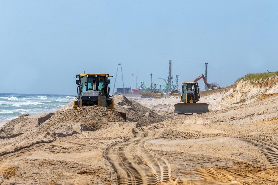 Earle Asphalt repairs beaches, where cliffs were created and fencing and walkovers damaged during winter and spring storms, in Ortley Beach, NJ Wednesday, May 10, 2023.