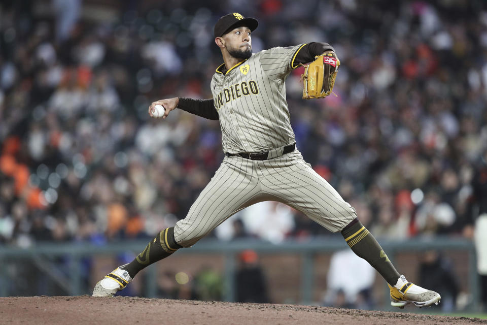 San Diego Padres pitcher Robert Suarez throws to a San Francisco Giants batter during the ninth inning of a baseball game in San Francisco, Saturday, April 6, 2024. (AP Photo/Kavin Mistry)