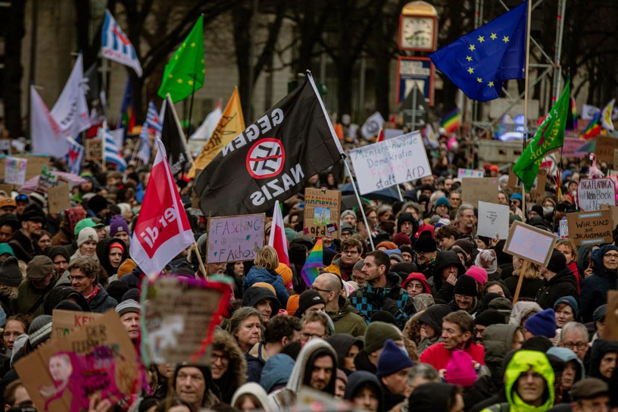 People in Hamburg, Germany, protest against right-wing extremism and the AfD party on Feb. 25, 2024. <a href="https://www.gettyimages.com/detail/news-photo/at-a-demonstration-against-right-wing-extremism-on-february-news-photo/2033875417?adppopup=true" rel="nofollow noopener" target="_blank" data-ylk="slk:Hami Roshan/Middle East Images/AFP via Getty Images;elm:context_link;itc:0;sec:content-canvas" class="link ">Hami Roshan/Middle East Images/AFP via Getty Images</a>