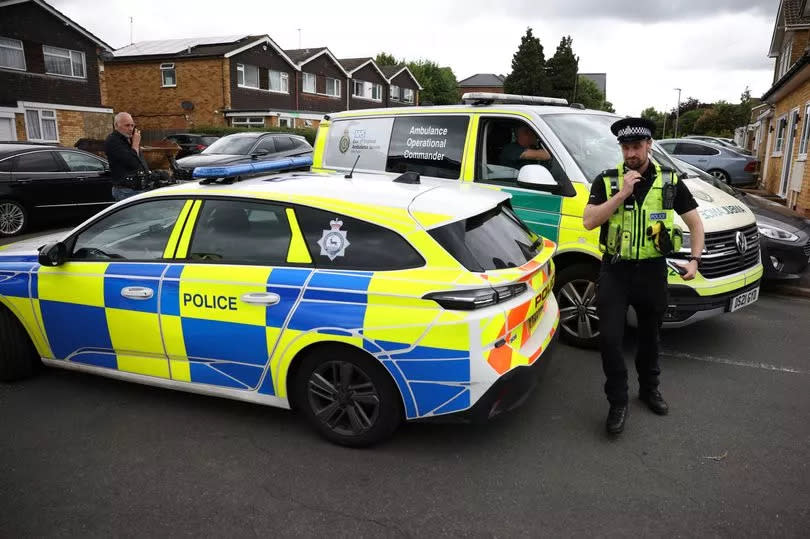 Police are at the scene where the three women were killed at their home on Tuesday