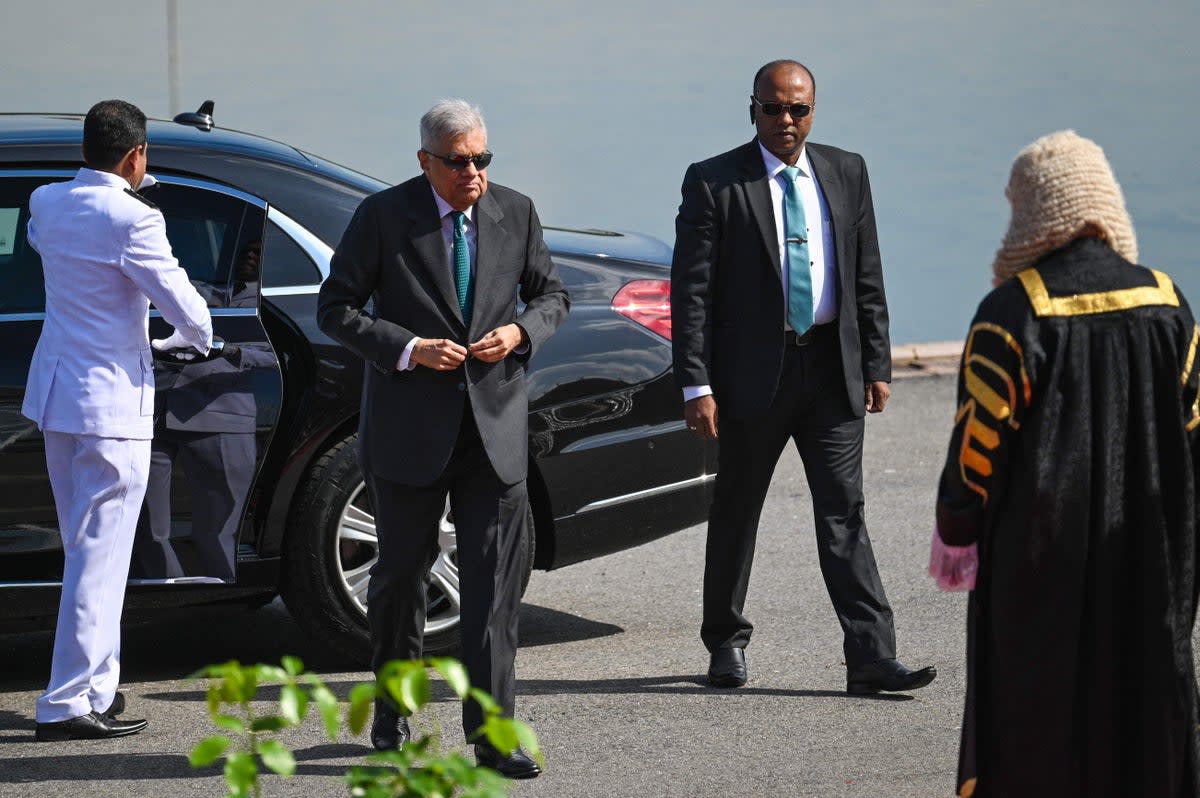 File Sri Lanka's President Ranil Wickremesinghe (2L) arrives for the opening session of the parliament in Colombo (AFP via Getty Images)