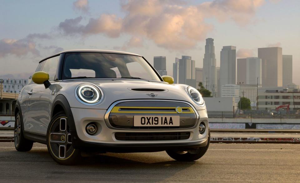 <p>Mini has been in and out of the EV business. This year, it's back in, with an updated version of its <a href="https://www.caranddriver.com/mini/cooper-s-e" rel="nofollow noopener" target="_blank" data-ylk="slk:electrified Mini Cooper;elm:context_link;itc:0;sec:content-canvas" class="link ">electrified Mini Cooper</a>. The small front-wheel-drive hatchback is powered by a single electric motor mounted under its hood that generates 181 horsepower and 199 pound-feet of torque. The battery pack is under the floor, which gives the Electric a low center of gravity and preserves its cargo space. Three trim levels are offered with prices starting just over $30,000, but its 32.6-kWh battery pack is small, so range is limited to just 110 miles. Aside from radically styled asymmetric three-hole wheels—and, if you want, Energetic Yellow trim—it looks basically like every other Cooper, both inside and out. Mini even left the hood scoop in place. And it runs like a Mini, with athletic handling and a 60-mph sprint of about seven seconds. </p>