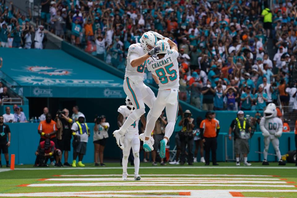 Sep 25, 2022; Miami Gardens, Florida, USA; Miami Dolphins wide receiver River Cracraft (85) celebrates his touchdown against the Buffalo Bills with tight end Mike Gesicki (88) during the first half at Hard Rock Stadium. Mandatory Credit: Jasen Vinlove-USA TODAY Sports