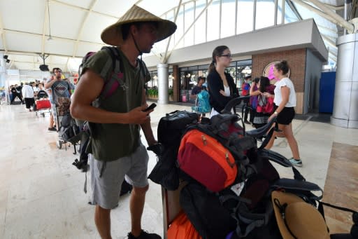 Tourists queue to depart from Lombok International Airport