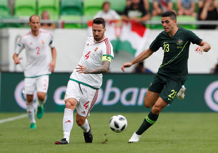 Soccer Football - International Friendly - Hungary vs Australia - Groupama Arena, Budapest, Hungary - June 9, 2018 Hungary's Tamas Kadar in action with Australia's Tom Rogic REUTERS/Bernadett Szabo