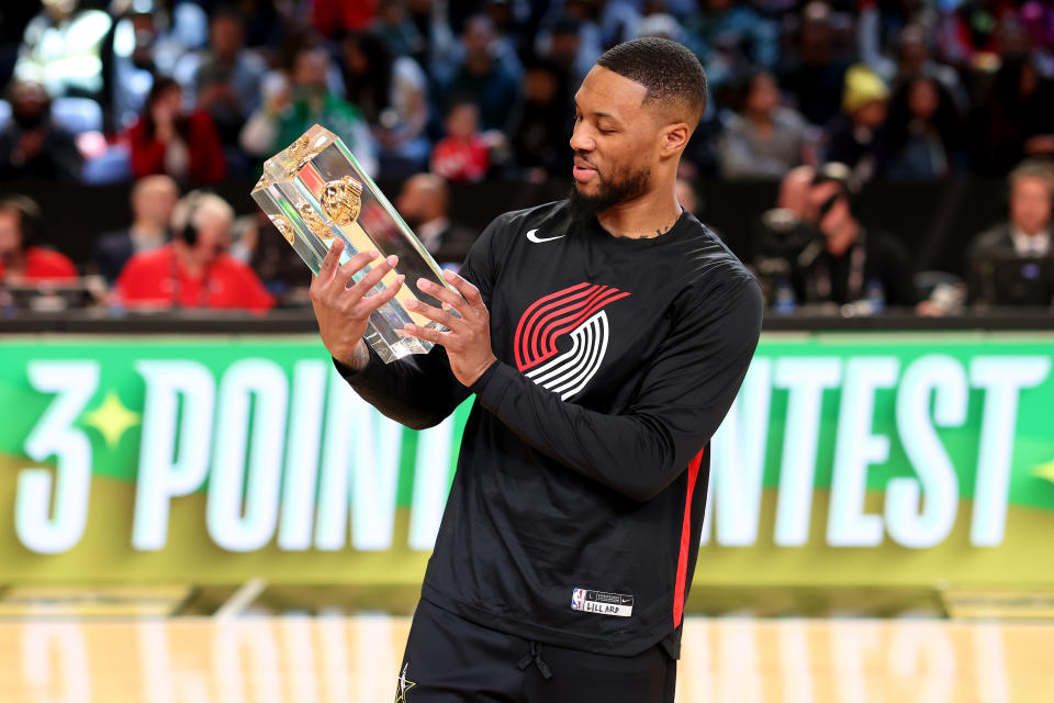 SALT LAKE CITY, UTAH – FEBRUARY 18: Damian Lillard #0 of the Portland Trail Blazers celebrates with the trophy after winning the 2023 NBA All Star Starry 3-Point Contest at Vivint Arena on February 18, 2023 in Salt Lake City, Utah. NOTE TO USER: User expressly acknowledges and agrees that, by downloading and or using this photograph, User is consenting to the terms and conditions of the Getty Images License Agreement. (Photo by Tim Nwachukwu/Getty Images)