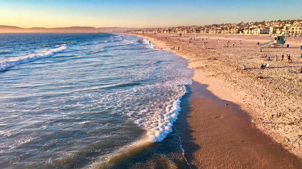 Hermosa Beach, California coastline with waves and homes in the distance