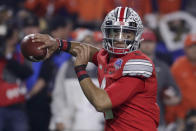 FILE - In this Dec. 28, 2019, file photo, Ohio State quarterback Justin Fields throws a pass against Clemson during the first half of the Fiesta Bowl NCAA college football playoff semifinal, in Glendale, Ariz. Clemson is preseason No. 1 in The Associated Press Top 25, Monday, Aug. 24, 2020, a poll featuring nine Big Ten and Pac-12 teams that gives a glimpse at what’s already been taken from an uncertain college football fall by the pandemic. Ohio State was a close No. 2. (AP Photo/Rick Scuteri, File)