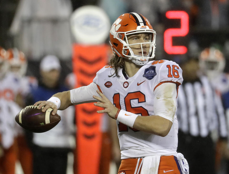 Clemson's Trevor Lawrence (16) looks to pass against Pittsburgh in the first half of the Atlantic Coast Conference championship NCAA college football game in Charlotte, N.C., Saturday, Dec. 1, 2018. (AP Photo/Chuck Burton)