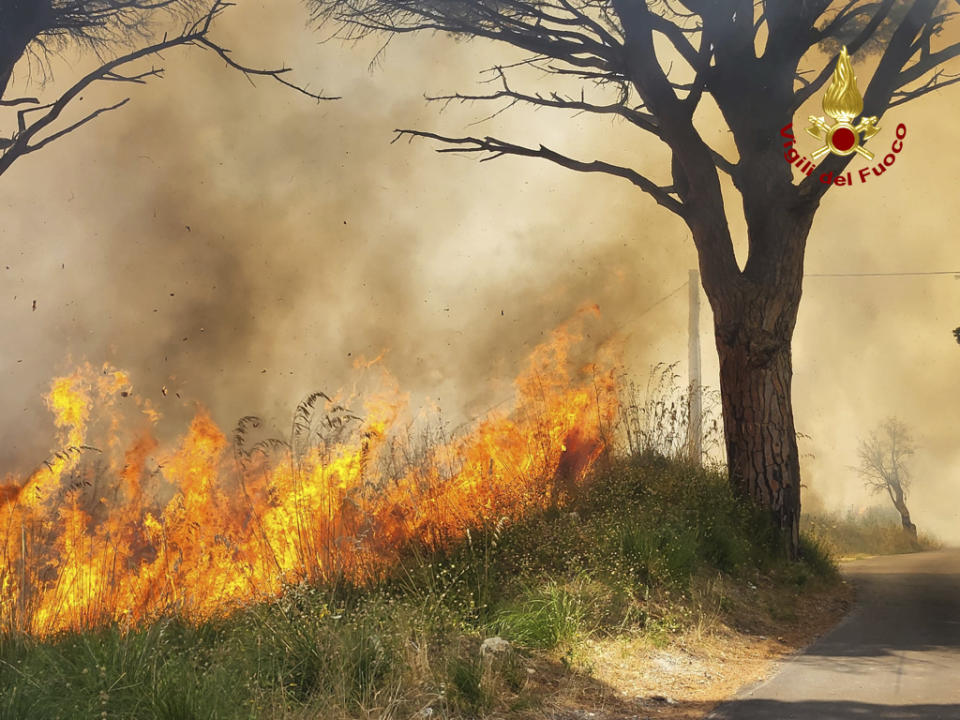 This picture released by the Italian firefighters shows wildfires in the region of Palermo in Sicily, Italy, Tuesday July 25, 2023. (Italian Firefighters - Vigili del Fuoco via AP)