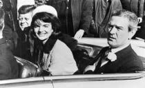 President John F. Kennedy and his wife, Jacqueline, smile as they drive with Texas Gov. John Connally of Texas from Love Field airport, in Dallas, on Nov. 22, 1963. (Photo: AP)