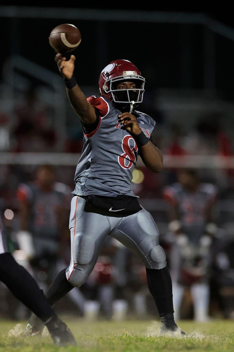 Raines' Roman Doles (8) looks to throw during an October game at Atlantic Coast. The senior quarterback committed to Bethune-Cookman football.