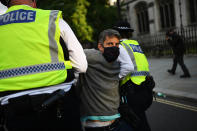 LONDON, ENGLAND - SEPTEMBER 01: Police officers detain protestors as Extinction Rebellion demonstrate in Westminster on September 1, 2020 in London, England. The environmental activist group organised several events across the UK timed for the return of government officials from the summer holiday. (Photo by Peter Summers/Getty Images)