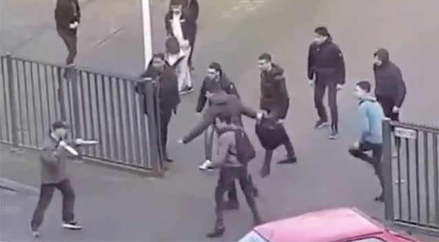 After falling over, the man got back on his feet and waved two large knives around. Source: LiveLeak