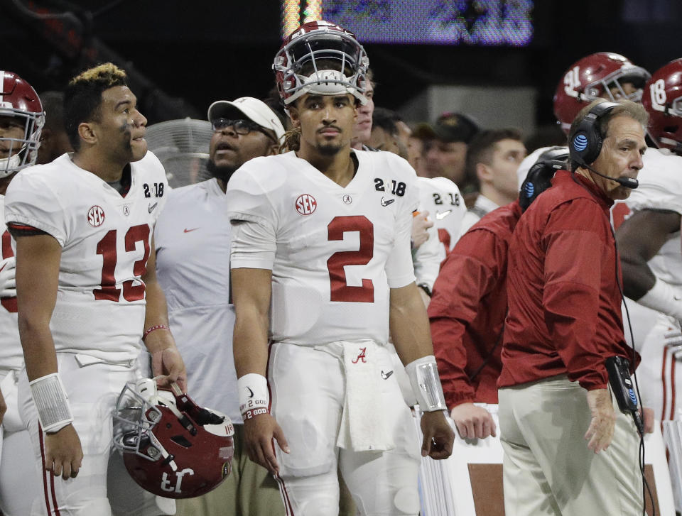 Alabama’s Jalen Hurts (2) is seen on the bench with Tua Tagovailoa (13) head coach Nick Saban during the second half of the NCAA college football playoff championship game against Georgia Monday, Jan. 8, 2018, in Atlanta. (AP Photo/David J. Phillip)