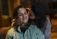 Saskia Niño de Rivera, right, a Mexican civil rights activist, and her girlfriend Mariel Duayhe, a sports agent for Mexican soccer players, pose for a photo at their apartment in Mexico City, Tuesday, Nov. 8, 2022. Saskia Niño de Rivera contemplated privately proposing in Qatar at the World Cup during a game, but as the lesbian couple learned more about laws against same-sex relations in the conservative Gulf country, she decided against the idea. (AP Photo/Fernando Llano)