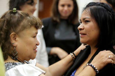 Claudia Hernandez (R), a victim of the 2006 land conflict in San Salvador Atenco in Mexico, is comforted after her hearing was convened by the judges of the Inter-American Court of Human Rights in San Jose, Costa Rica November 16, 2017. REUTERS/Juan Carlos Ulate