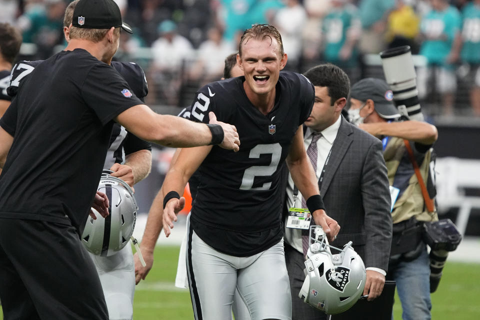 Las Vegas Raiders kicker Daniel Carlson (2) reacts while running off the field after the Las Vegas Raiders defeated the Miami Dolphins in overtime of an NFL football game, Sunday, Sept. 26, 2021, in Las Vegas. (AP Photo/Rick Scuteri)