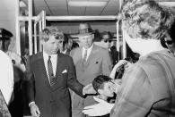 <p>Sen. Robert F. Kennedy arrives at the Jackson, Miss., airport, for an antipoverty hearing, April 10, 1967. (Photo: Jack Thornell/AP) </p>