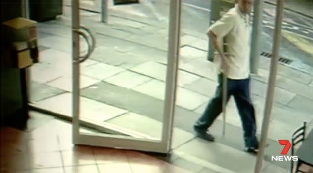 CCTV captured a man carrying a sword. Picture: 7 News