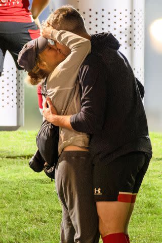 <p>Diggzy/Jesal / SplashNews</p> Ant Anstead and Renée Zellweger share a kiss during Anstead's first soccer game of the season.