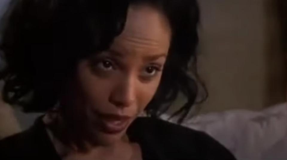 Lynn Whitfield looks at someone offscreen looking very annoyed.