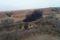 Investigators, cleanup crews begin scouring oil pipeline spill in Kansas