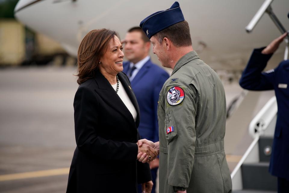 Vice President Kamala Harris is greeted by Col. Ted Geasley, Commander of the 118th Wing, as she arrives at Berry Field Air National Guard Base before meeting with Tennessee legislators at Fisk University in Nashville, Tenn., on Friday, April 7, 2023. 