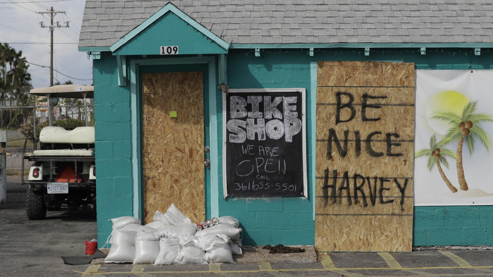 <p>A sign reading “Be Nice Harvey” was left behind on a boarded up business, Thursday, Aug. 24, 2017, in Port Aransas, Texas. (Photo: Eric Gay/AP) </p>