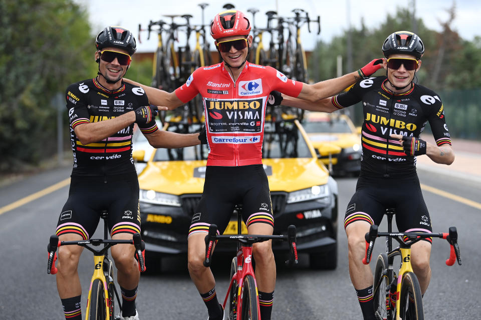 Sepp Kuss (middle) flanked by teammates Jonas Vingegaard (left) and Primož Roglič. (Tim de Waele/Getty Images)