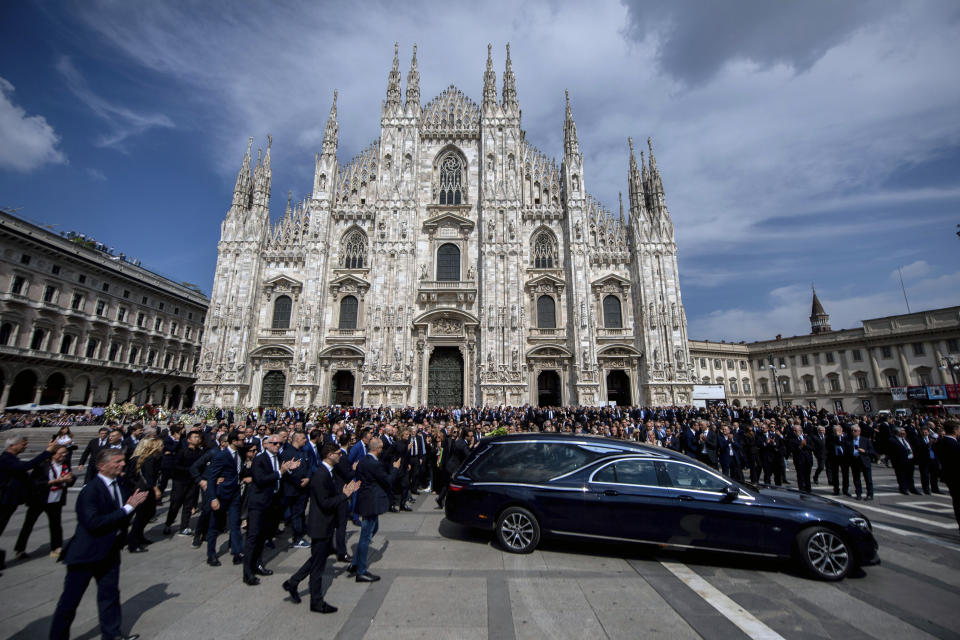 The hearse carrying the casket of former Italian premier Silvio Berlusconi leaves after his state funeral inside Milan's Duomo Gothic-era Cathedral, Italy, Wednesday, June 14, 2023. Berlusconi died at the age of 86 on Monday in a Milan hospital where he was being treated for chronic leukemia. (Claudio Furlan/LaPresse via AP)