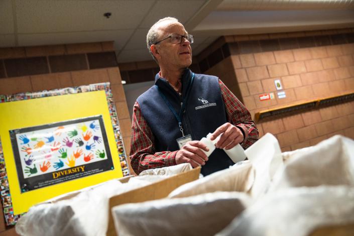 John Holcombe, environmental coordinator for Poudre School District, works to collect water samples at Johnson Elementary School on Thursday in Fort Collins.  The district is working to test for lead in water sources at all of its elementary schools by May 31, as is required by a new Colorado law that went into effect on Jan.  1.