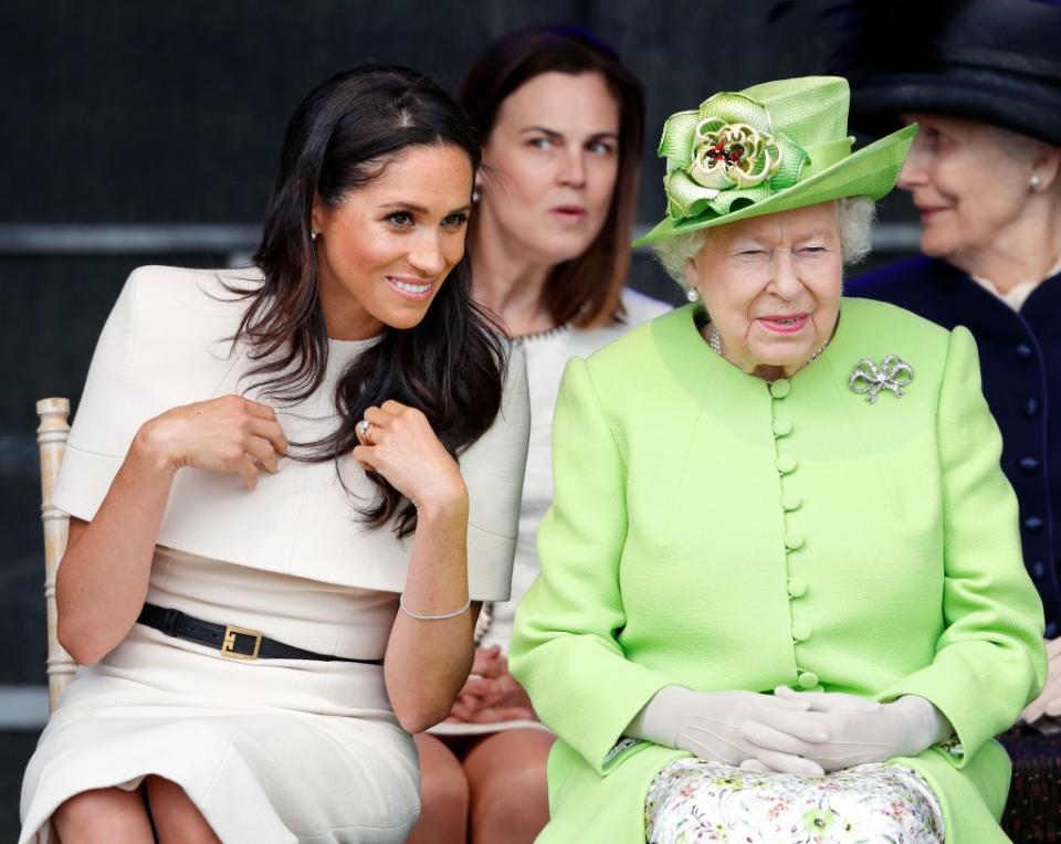 Per the queen’s request, Cohen (center) eventually started working for Prince Harry and his new wife Meghan Markle in 2018. Max Mumby/Indigo/Getty Images