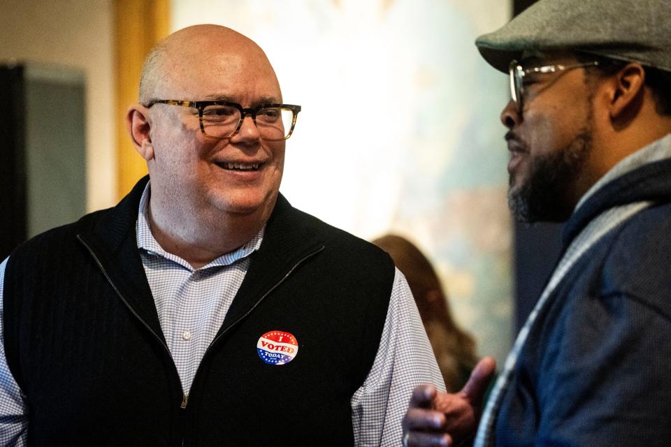 Mike Simonson speaks with a supporter during his special election watch party at Hoyt Sherman Place on Tuesday, March 19, 2024, in Des Moines.