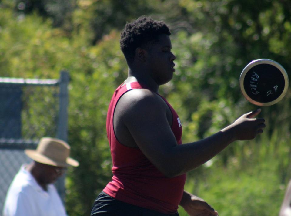Solomon Thomas of Raines flips his discus while on the way to the cage for the boys discus during the FHSAA Region 1-2A track meet. The nationally-ranked football lineman earned first place in the event.