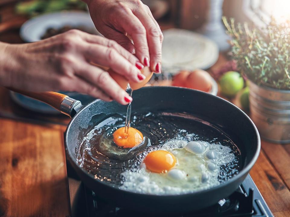 Frying Egg in a Cooking Pan in Domestic Kitchen