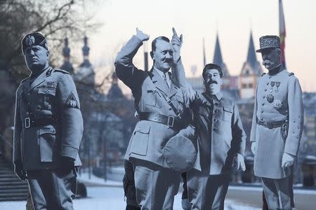 Activists placed life-size cardboards, depicting Benito Mussolini, Adolf Hitler, Josef Stalin and Philippe Petain in front of the Kaiser Wilhelm monument at the Deutsches Eck ("German Corner") to protest against a European far-right leaders meeting, in Koblenz, Germany, January 21, 2017. REUTERS/Kai Pfaffenbach/File Photo