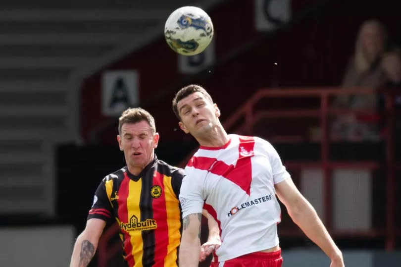 Airdrie's Nikolay Todorov is challenge by Thistle's Aaron Muirhead, as the sides clashed at Firhill