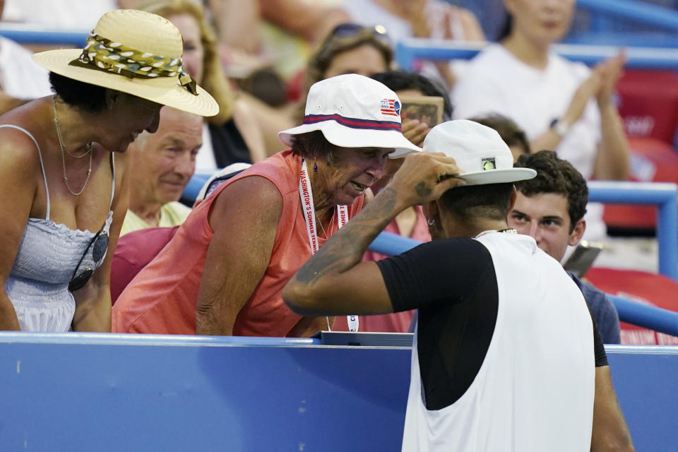 Nick Kyrgios, of Australia, talks to spectators after reaching match point against Marcos Giron, of the United States, at the Citi Open tennis tournament in Washington, Tuesday, Aug. 2, 2022. (AP Photo/Carolyn Kaster)