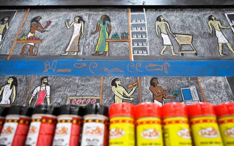 Chalk art with an ancient Egyptian theme, created by meat cutter Scott Bolter, is on display at the Clovis WinCo. Better known as Scott In Meat, he often includes himself in his drawings, seen at the bottom left corner.
