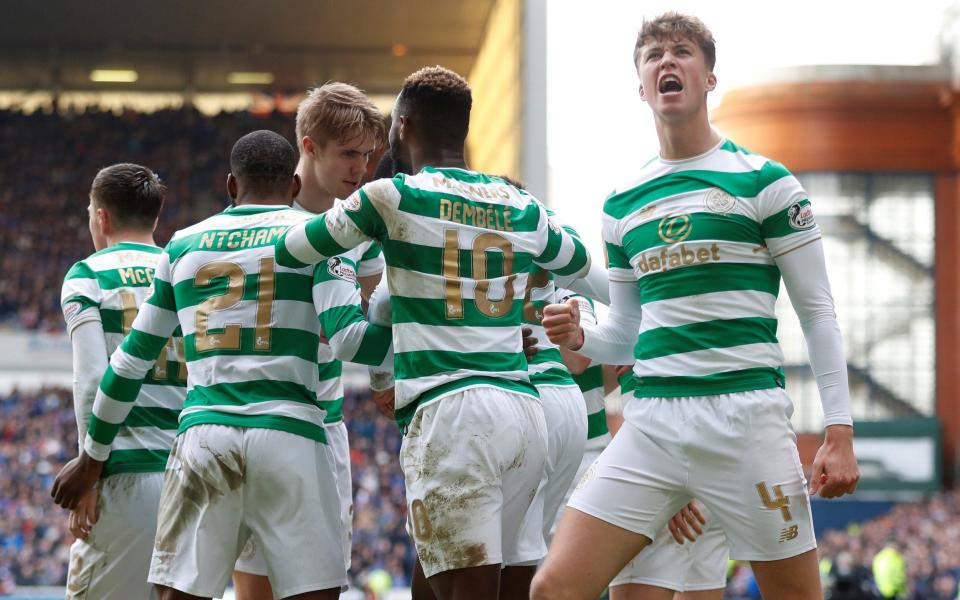 Celtic players celebrate Odsonne Edouard's winner at Ibrox - REUTERS