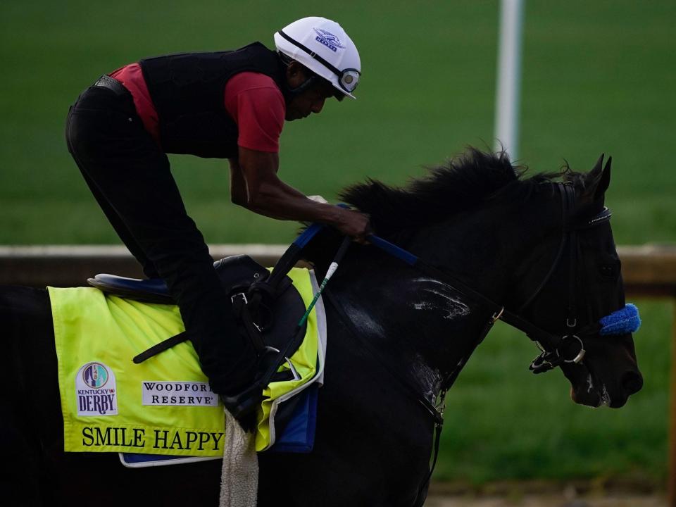 Kentucky Derby entrant Smile Happy works out at Churchill Downs.