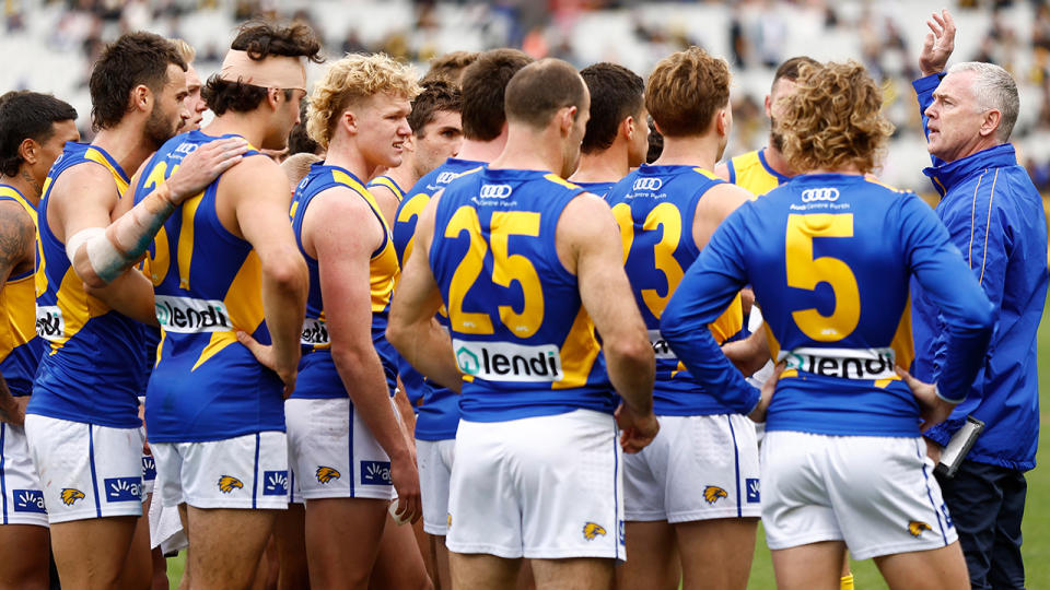 West Coast coach Adam Simpson speaks to the Eagles in a huddle.